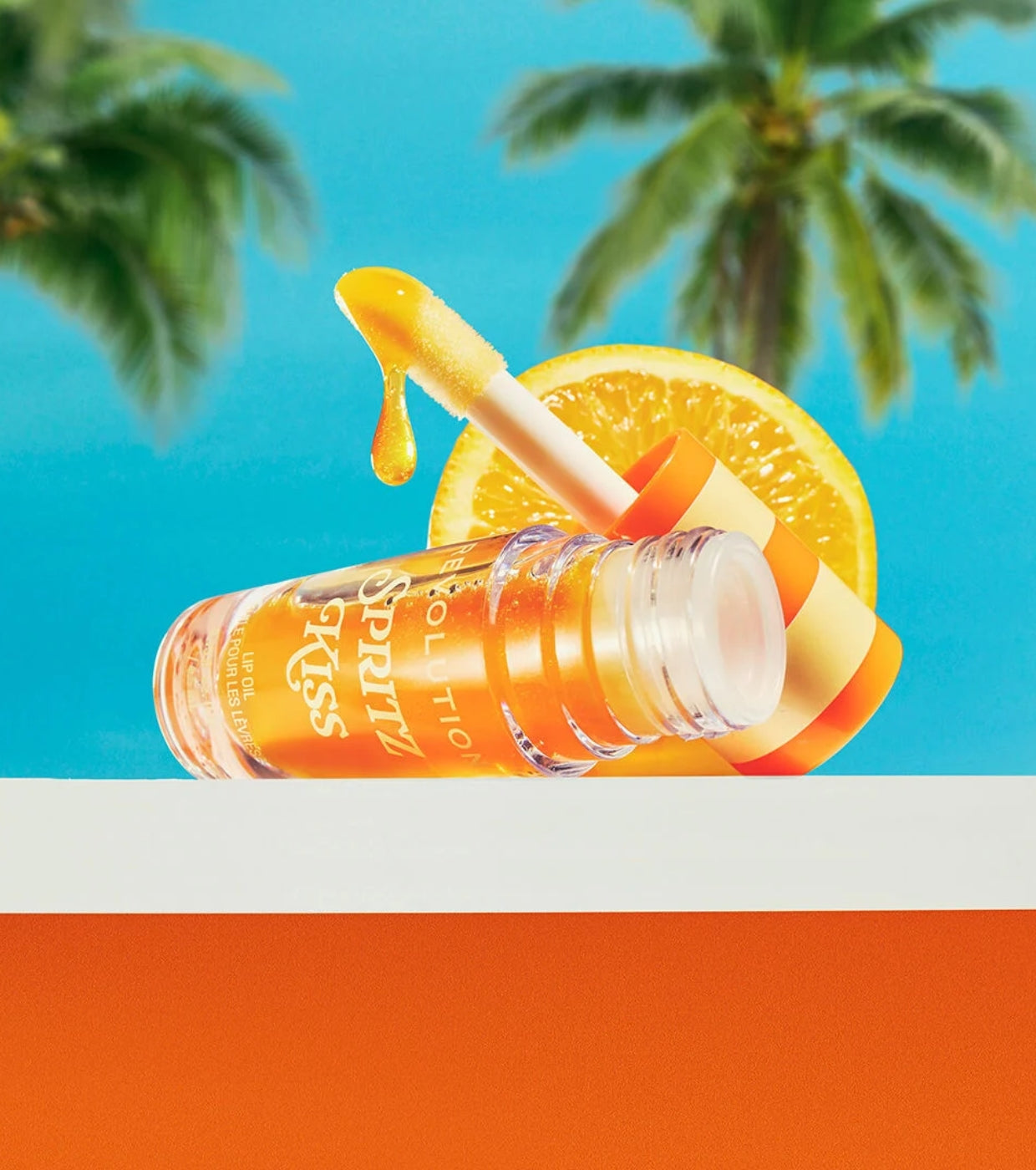 Makeup Revolution - *Club Riviera*  - Aceite labial Spritz Kiss Orange
